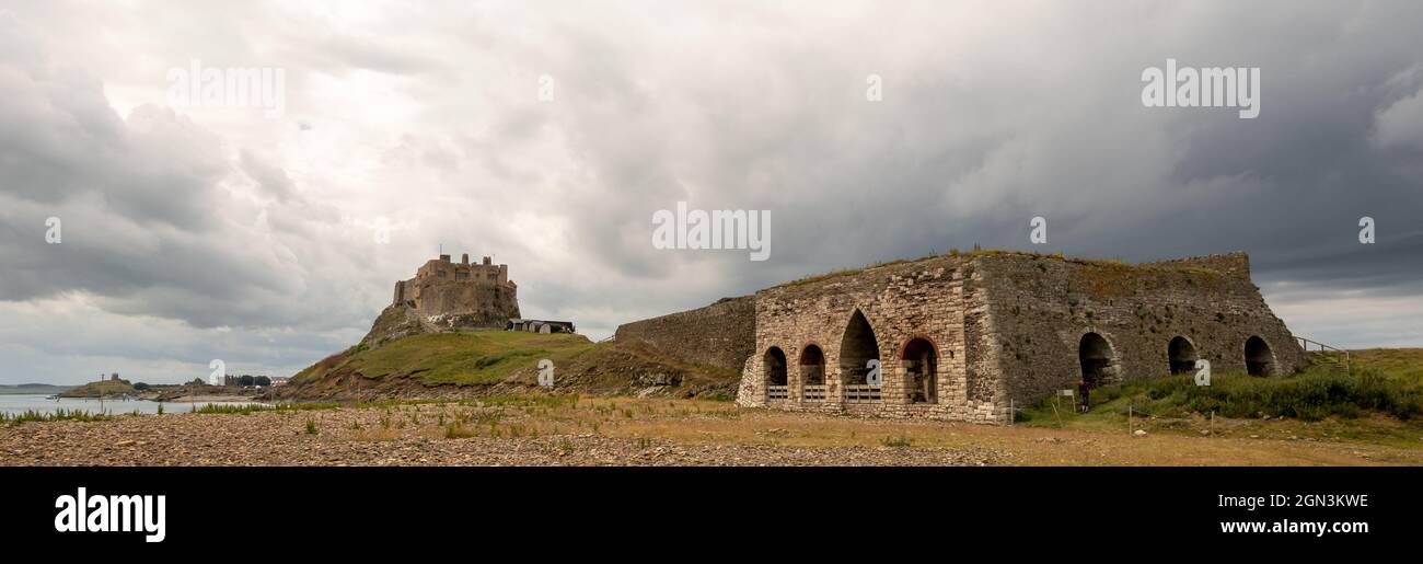 Lindisfarne Castle and lime kiln on Holy Island viewed from the beach Stock Photo