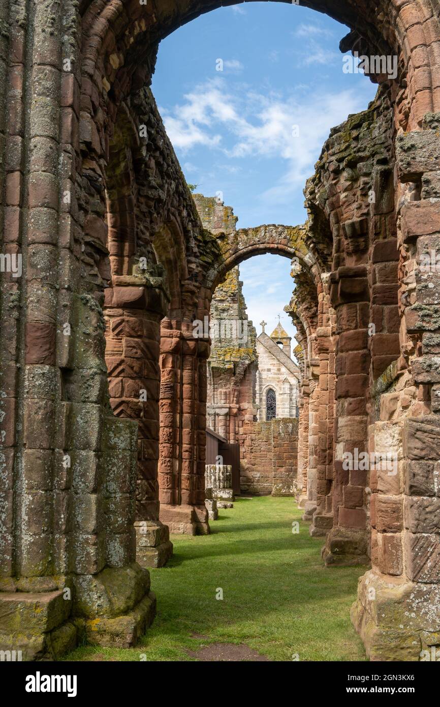 A line of columns and arches at Lindisfarne Priory, Holy Island Stock Photo