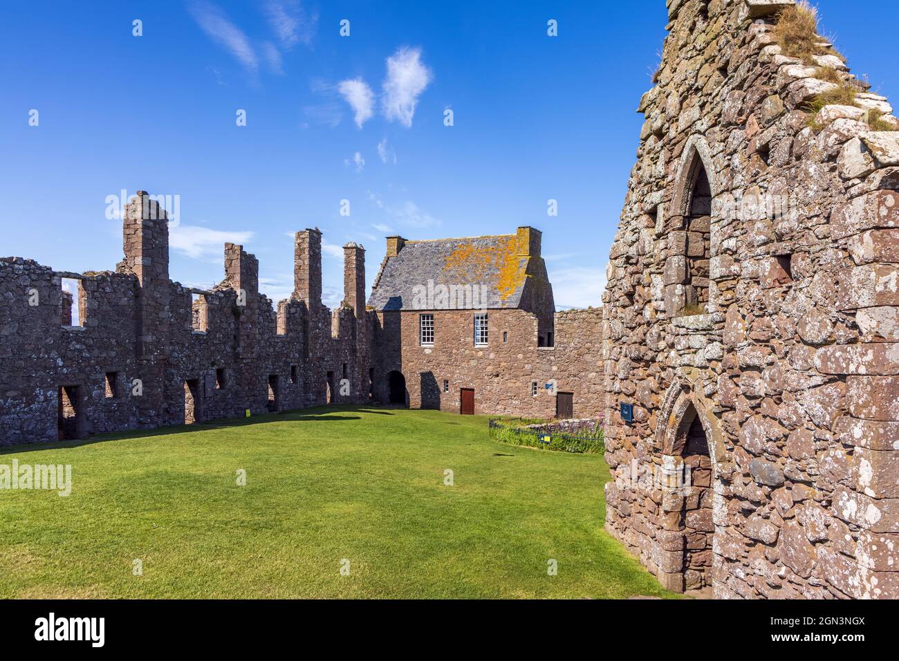 Remains of the medieval fortress, Dunnottar Castle, located upon a rocky headland on the north east coast of Scotland near Stonehaven, Aberdeenshire. Stock Photo