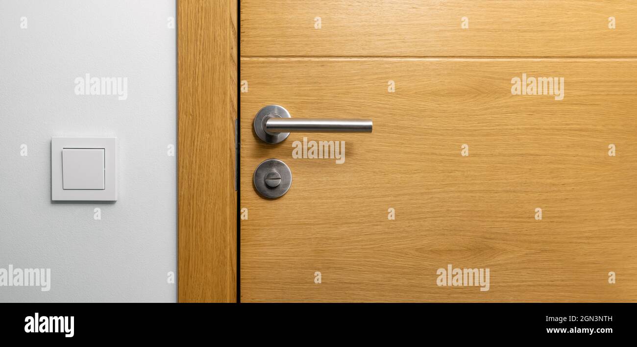 brown wooden door with metal handle. copy space Stock Photo
