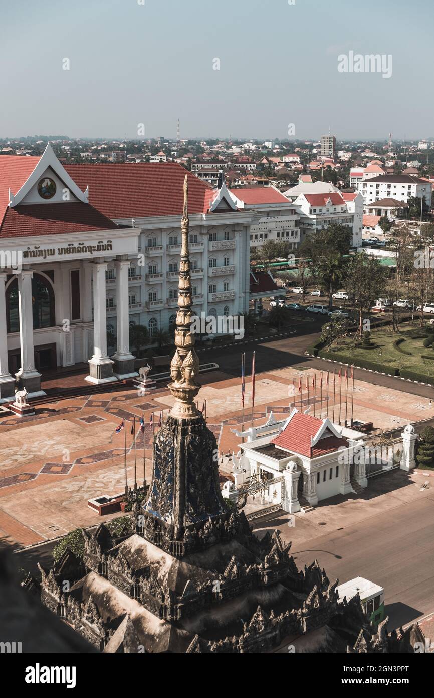 Square in the capital of Laos. White historic building with columns. High quality photo Stock Photo