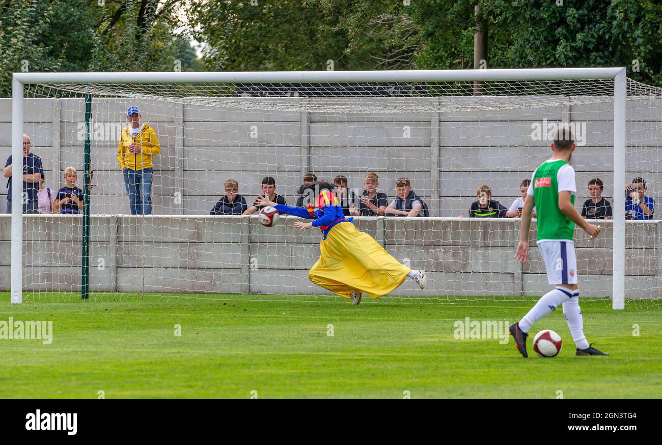 Snow White dives to save a penalty during a Stag Party at Trafford FC Stock Photo