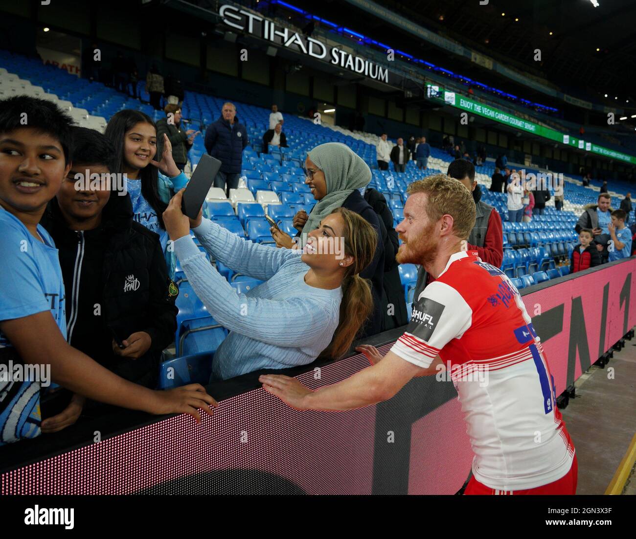 Manchester, UK. 21st Sep, 2021. Daryl Horgan of Wycombe Wanderers poses for photos with Man City supporters during the Carabao Cup match between Manchester City and Wycombe Wanderers at the Etihad Stadium, Manchester, England on 21 September 2021. Photo by Andy Rowland. Credit: PRiME Media Images/Alamy Live News Stock Photo