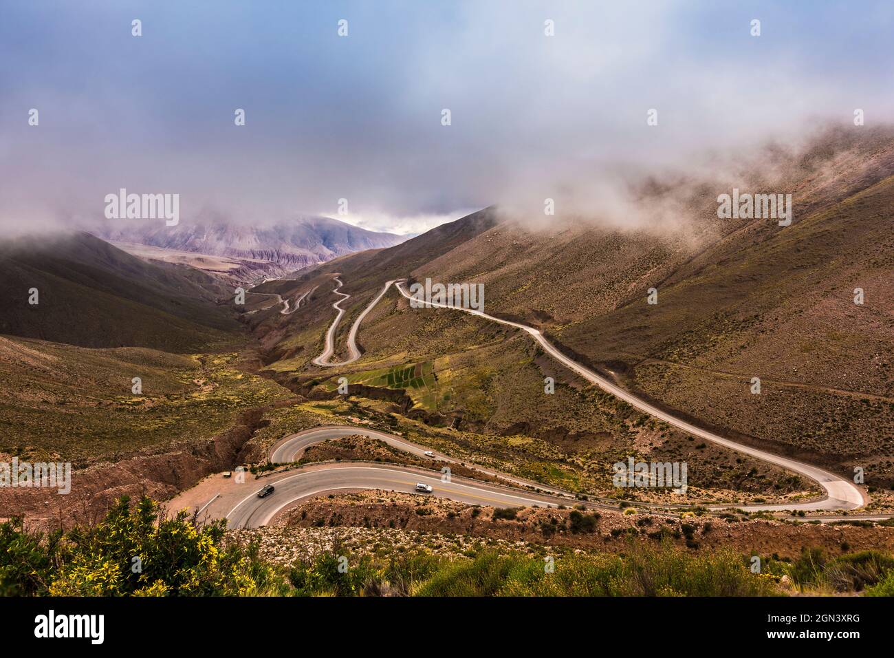 Dangerous mountain road with many turns one above each other between the mountains in an expressive cloudy day. Cuesta del Lipán, Jujuy, Argentina. Stock Photo