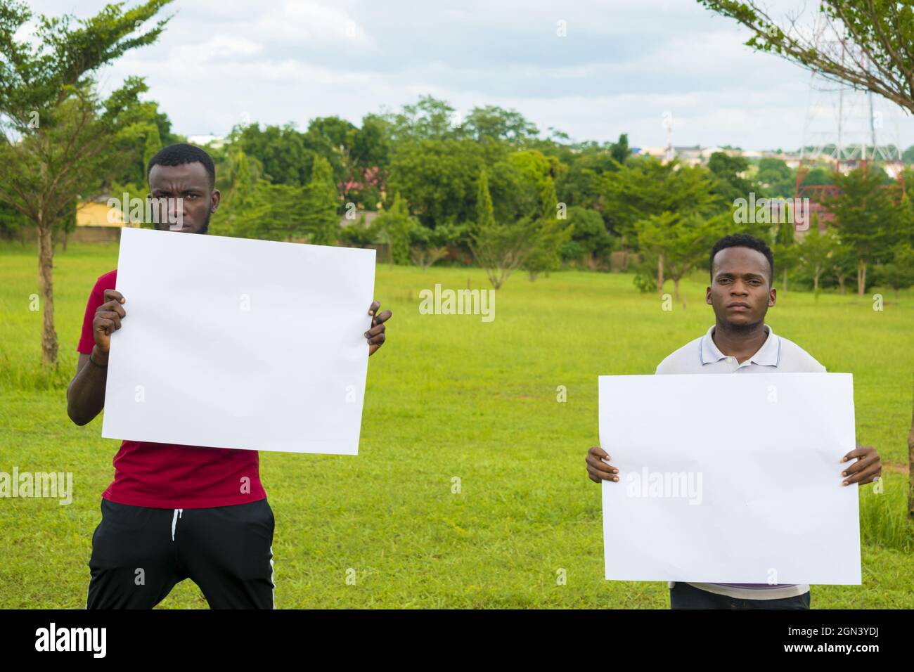 Men holding banner hi-res stock photography and images - Alamy