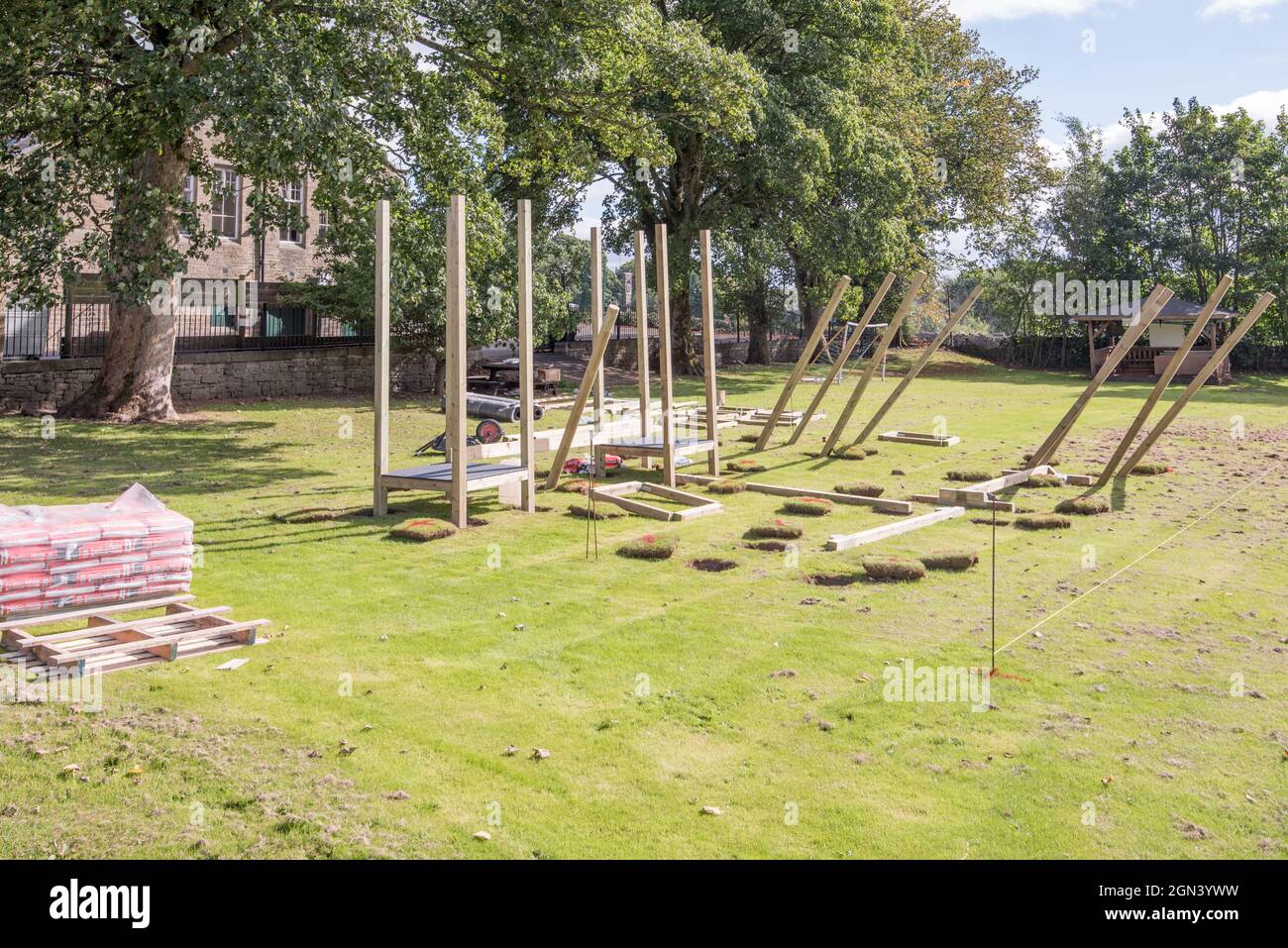 Outdoor,all weather,modular,wooden and steel playground equipment being installed at Long Preston Endowed school during September 2021. Stock Photo