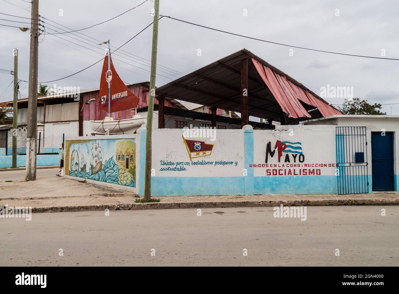 GIBARA,  CUBA - JAN 29, 2016: Propagandistic murals in Gibara village. It says: United for the prosperous and sustainable socialis; united for the con Stock Photo
