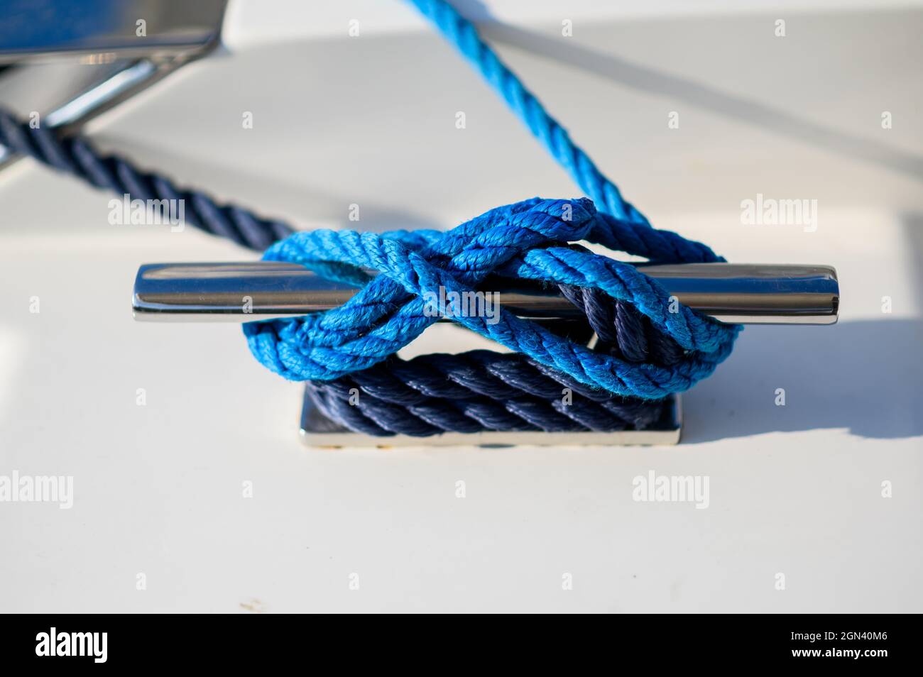 Mooring rope. Blue mooring rope tied around steel anchor on boat or ship Stock Photo Alamy