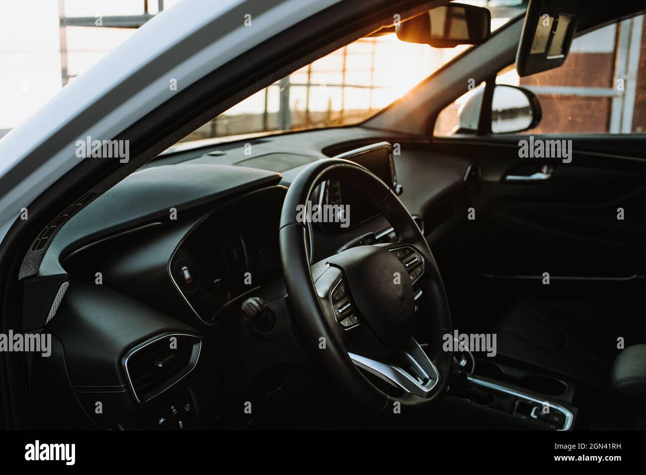 Luxury car interior steering wheel, shift lever and dashboard Stock