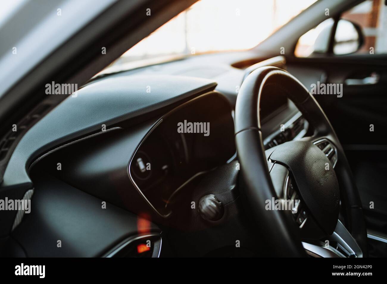 Luxury car interior steering wheel, shift lever and dashboard Stock