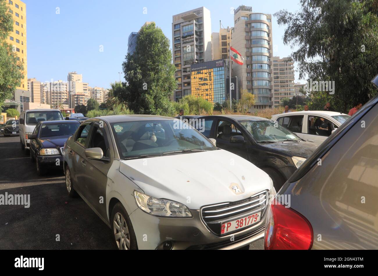Beirut, Lebanon. 21st Sep, 2021. A long line of cars wait for fuel on a