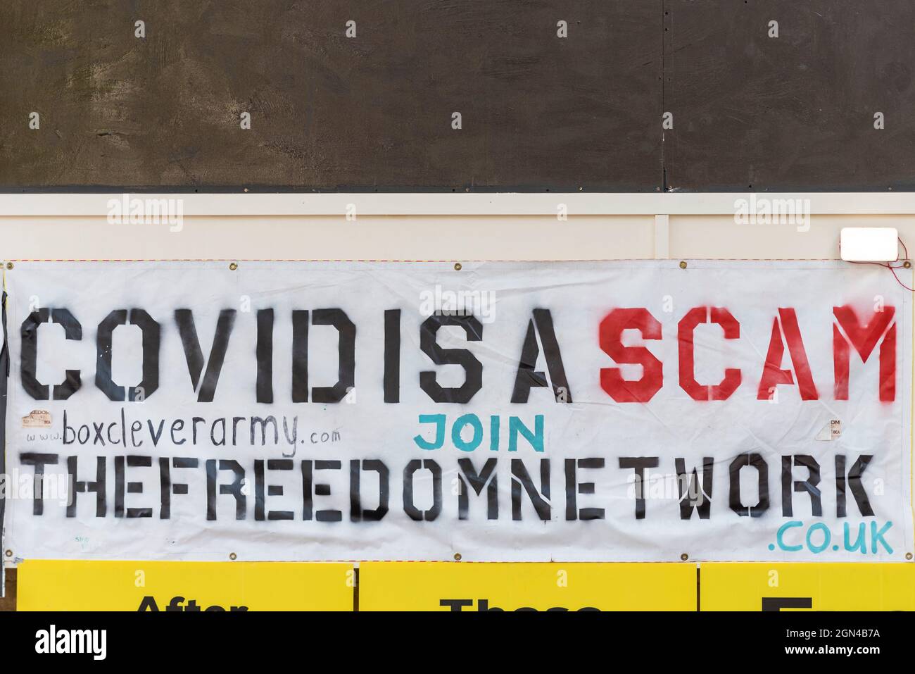 COVID hoax banner, sign. Covid is a scam. The freedom network. Box clever army. Covid 19, Coronavirus pandemic hoax message Stock Photo