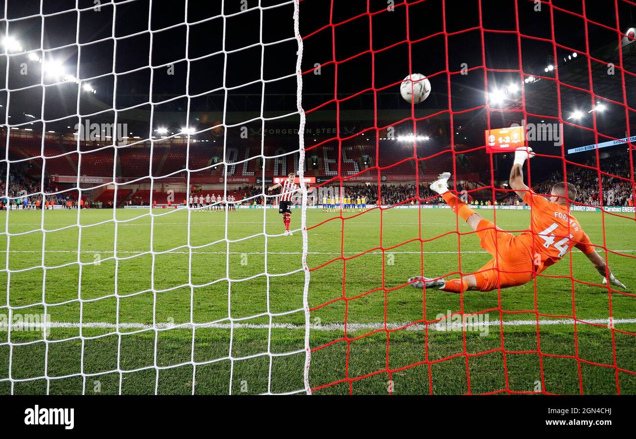 Sheffield, England, 21st September 2021.  Ben Osborn of Sheffield Utd scores past Fraser Forster of Southampton during a penalty shoot out to decide the Carabao Cup match at Bramall Lane, Sheffield. Picture credit should read: Darren Staples / Sportimage Credit: Sportimage/Alamy Live News Stock Photo
