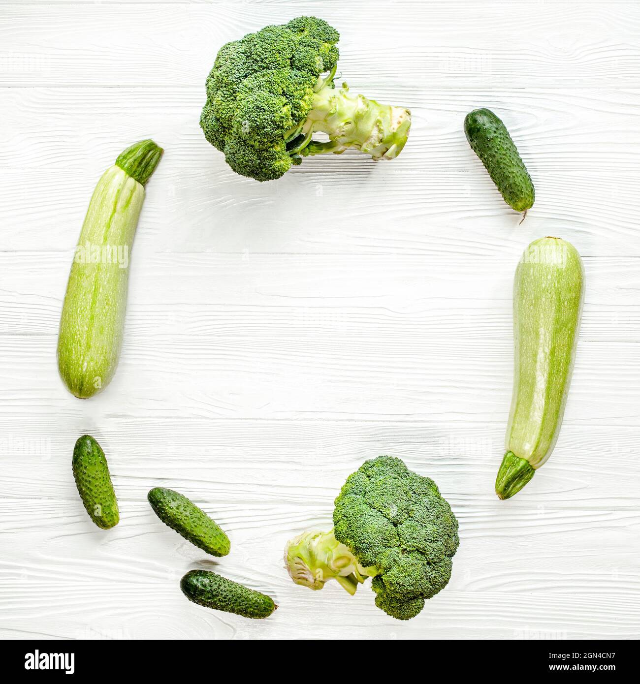 Healthy food on white wooden background. round Frame of vegetables ...