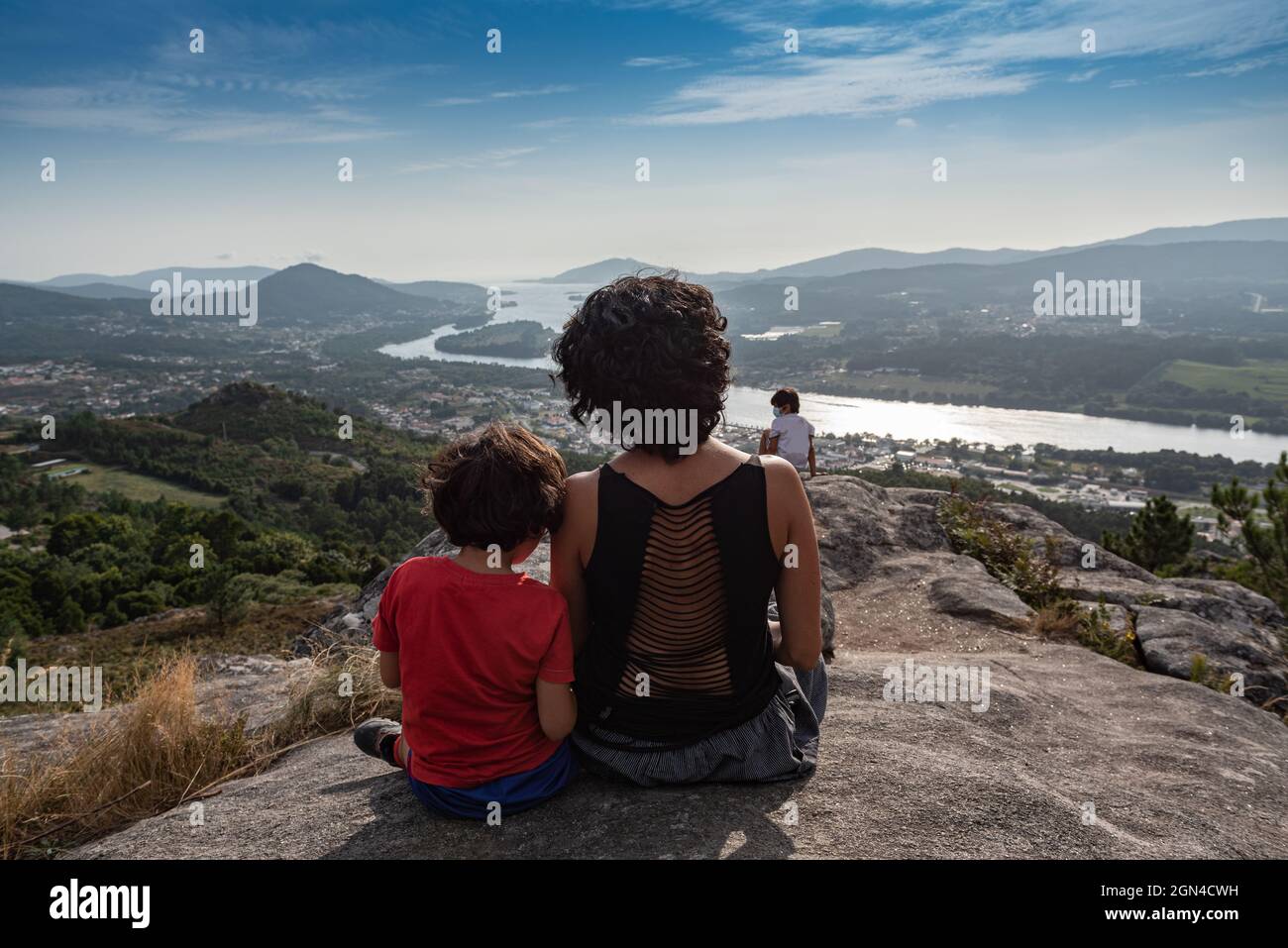 landscape with a young Caucasian woman and kid. Stock Photo