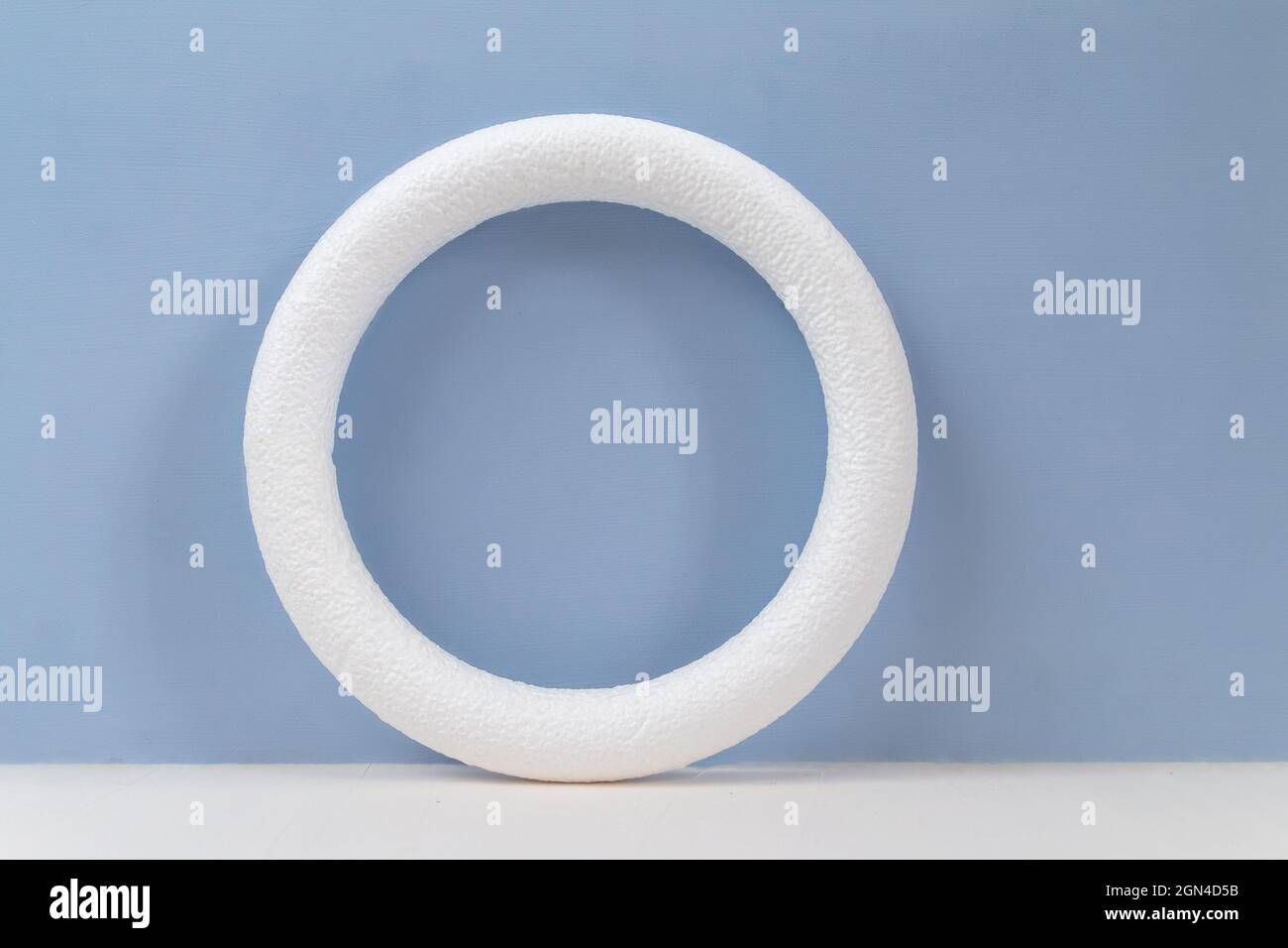 empty circle frame for object presentation or text against light blue background Stock Photo