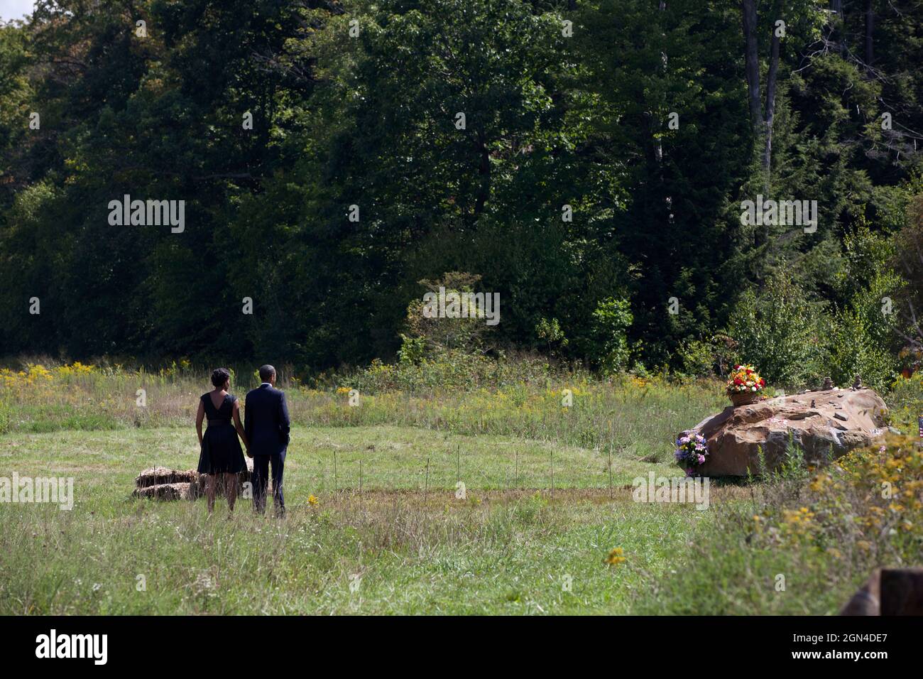 President Barack Obama and First Lady Michelle Obama visit the crash site following a ceremony at the Flight 93 National Memorial in Shanksville, Pa., on the tenth anniversary of the 9/11 attacks against the United States, Sunday, Sept. 11, 2011. (Official White House Photo by Pete Souza) This official White House photograph is being made available only for publication by news organizations and/or for personal use printing by the subject(s) of the photograph. The photograph may not be manipulated in any way and may not be used in commercial or political materials, advertisements, emails, produ Stock Photo