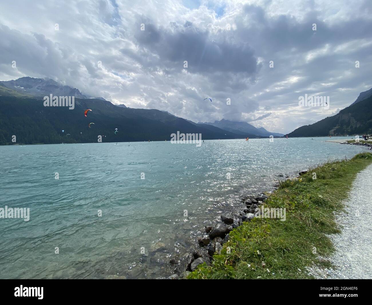 Beathtaking view of a lake in the mountain landscape under a cloudy sky Stock Photo