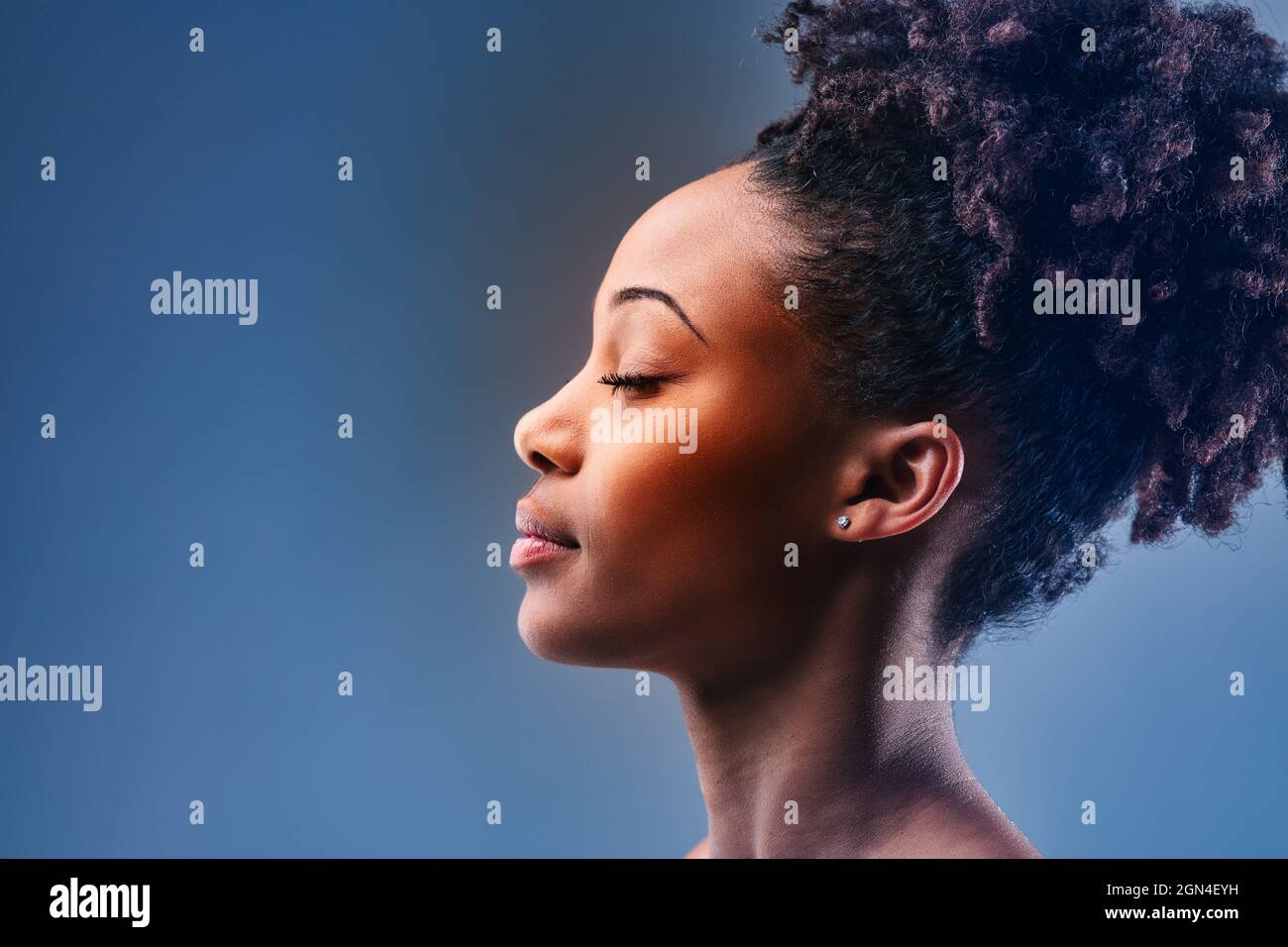 Side profile portrait of a beautiful black woman. Stock Photo