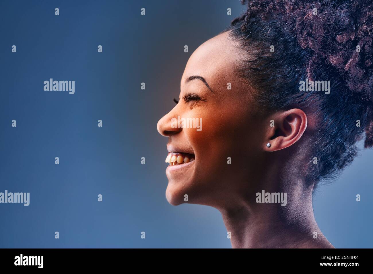 Happy young Black woman with a vivacious beaming smile posing in ...