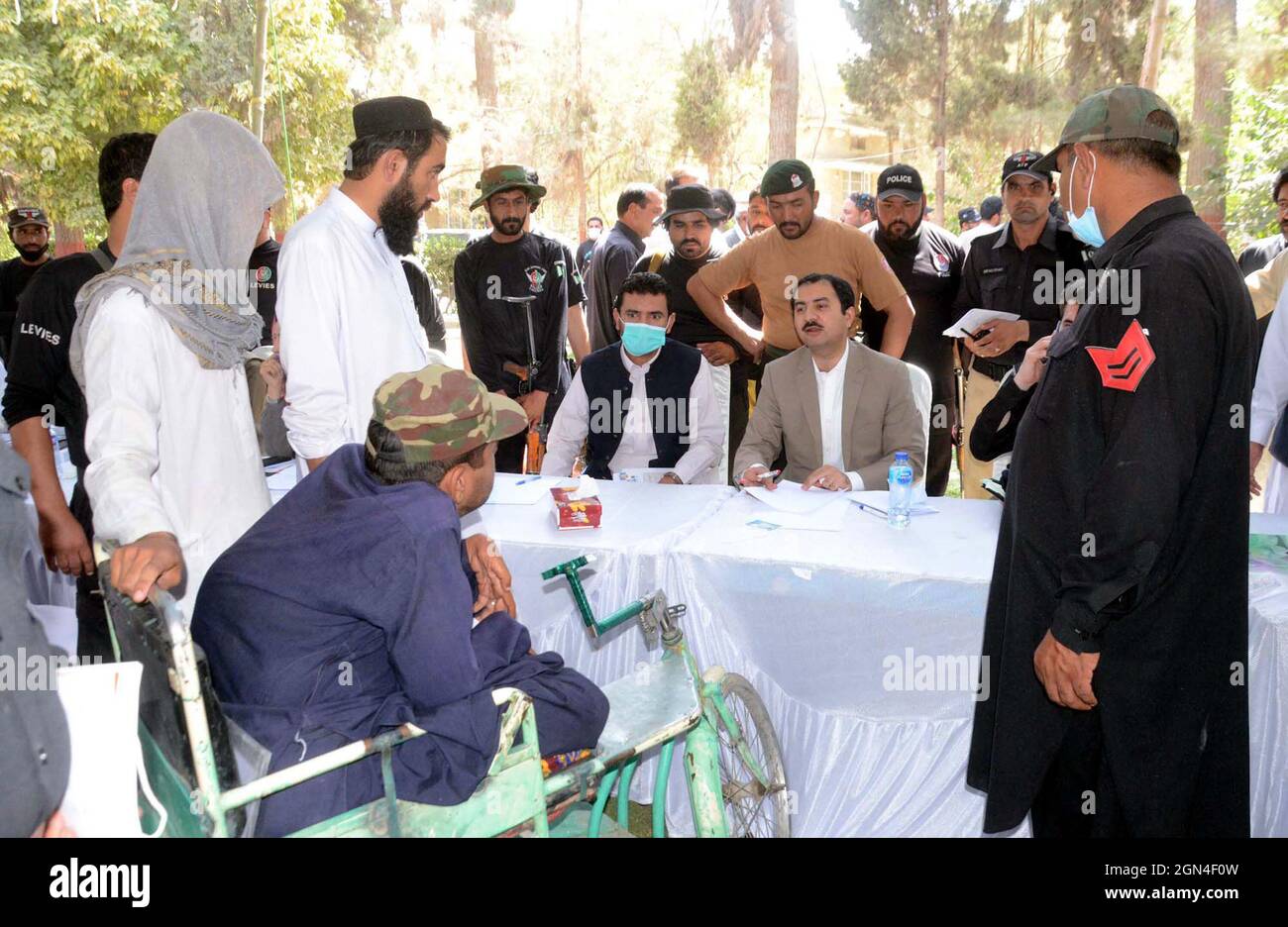 Deputy Commissioner Quetta, Irfan Nawaz Memon listening the problems of citizens during the open courts held in Quetta on Wednesday, September 22, 2021. Stock Photo