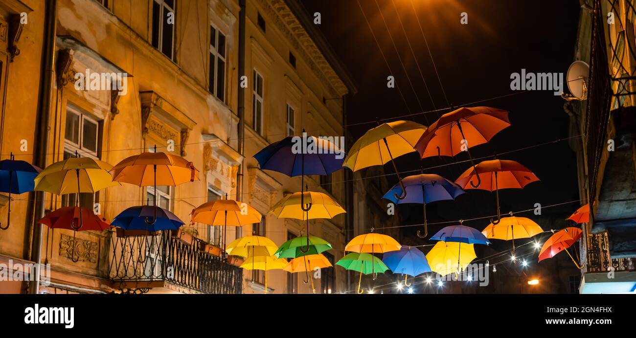 colorful umbrellas under the roof top on the street Stock Photo