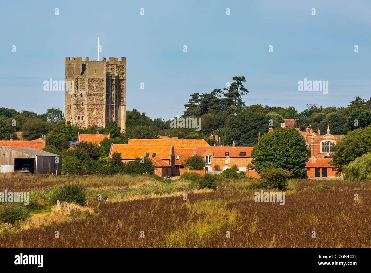 Orford Castle across the fields, from the River Ore, Orford, Suffolk, England Stock Photo