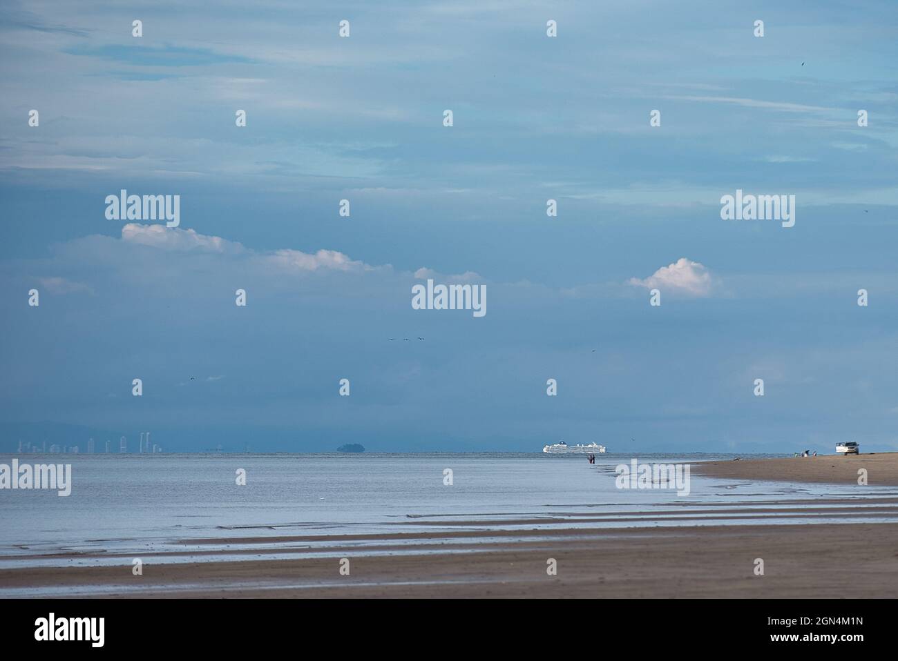 Beautiful view of a beach under the cloudy sky Stock Photo - Alamy