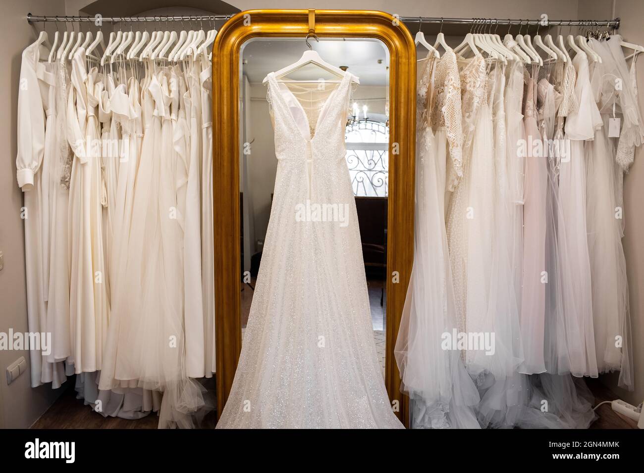 Wedding dresses hanging on a hanger. Fashion look. Interior of bridal