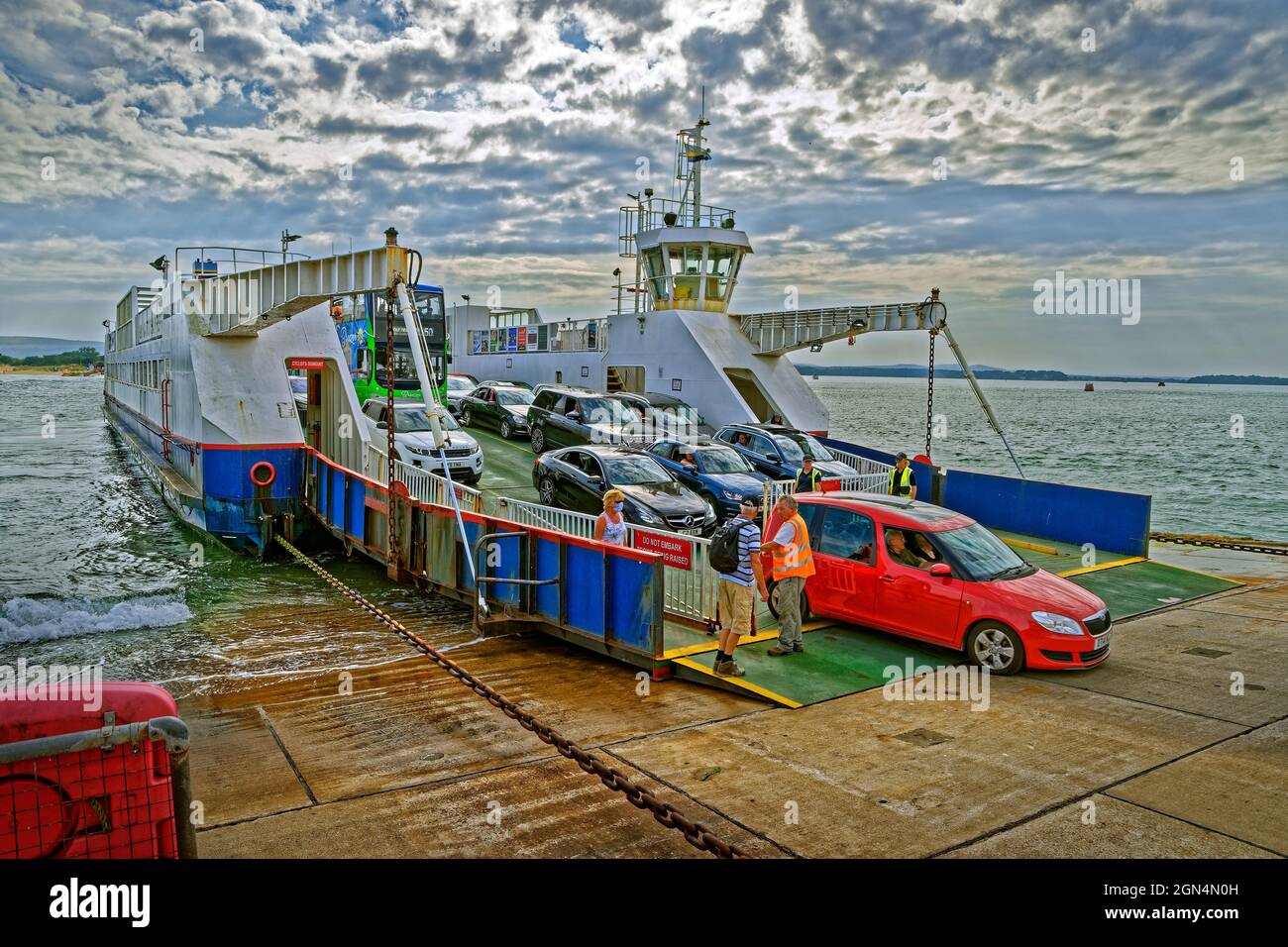 The Sandbanks Ferry offloading at Sandbanks Terminal at Sandbanks, Dorset, England. Stock Photo