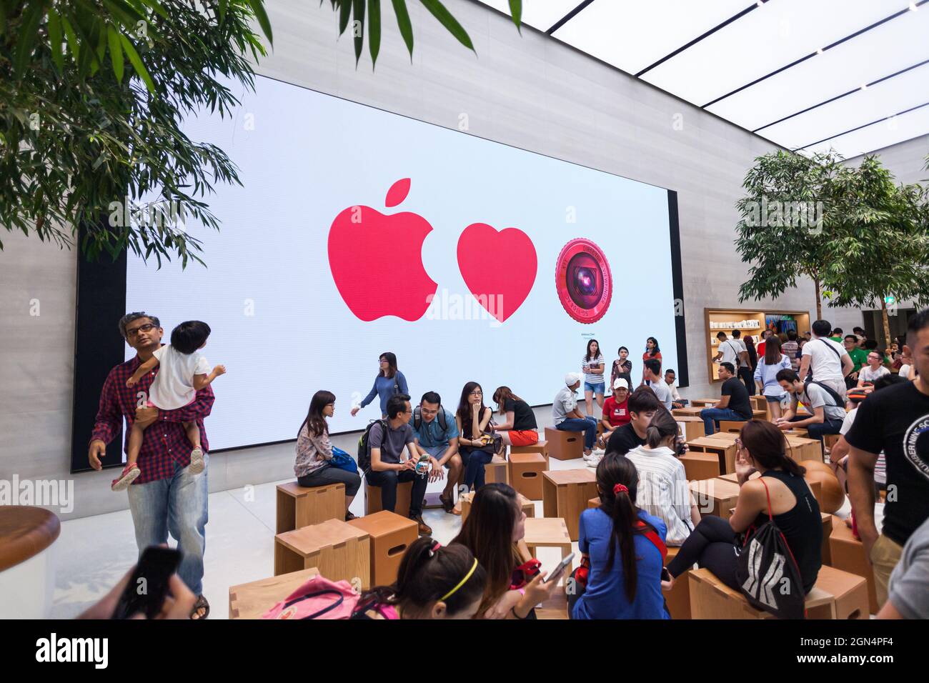 SINGAPORE - MAY 28, 2017: People enjoy their time in the new Apple Store at Orchard Road on May 28, 2017 Stock Photo
