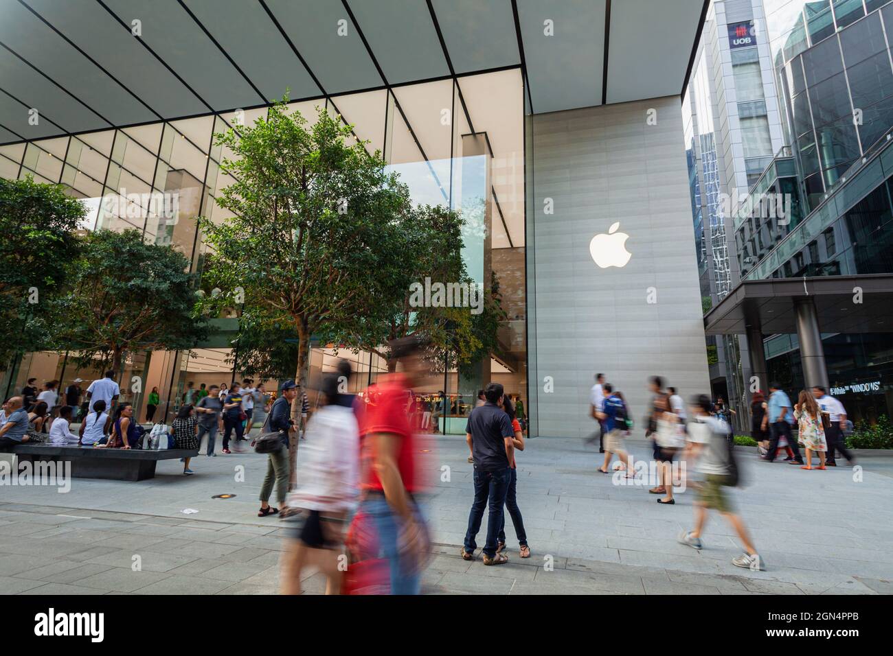 SINGAPORE - MAY 28, 2017: People pass by the new Apple Store at Orchard Road on May 28, 2017 Stock Photo