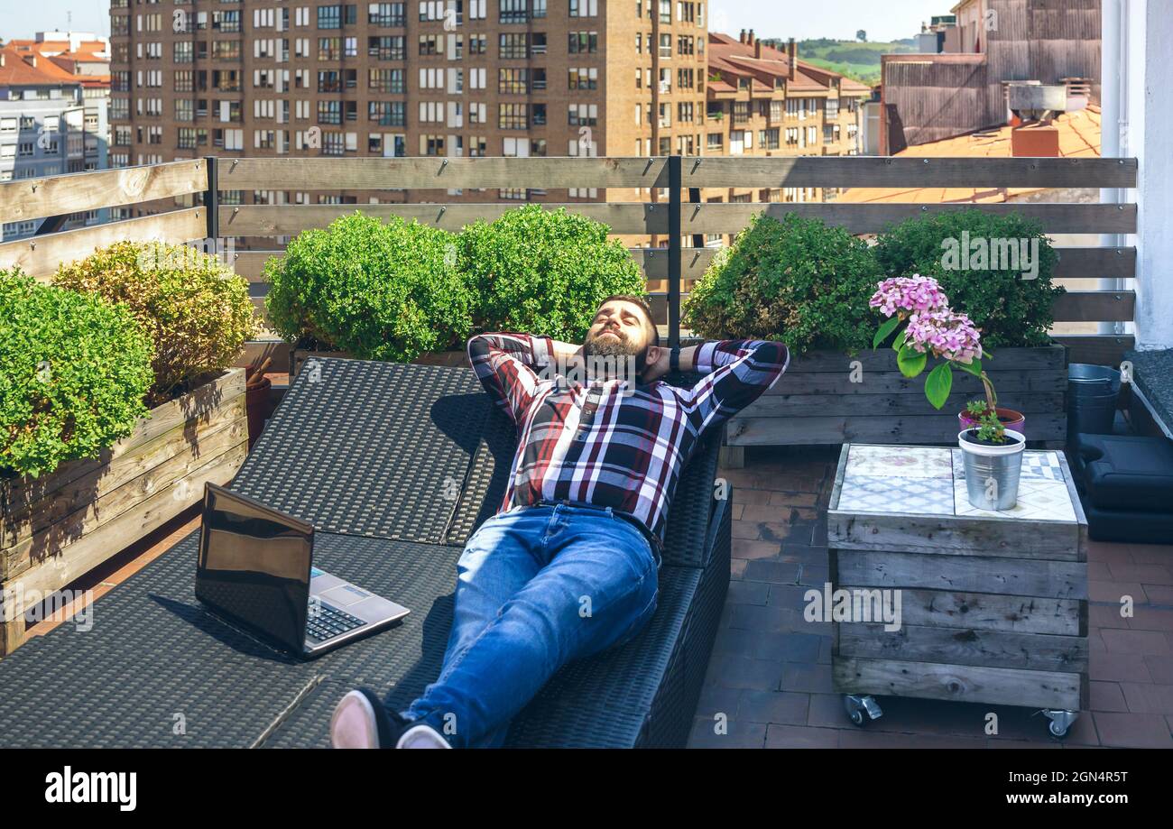 People resting on terrace hi-res stock photography and images - Alamy