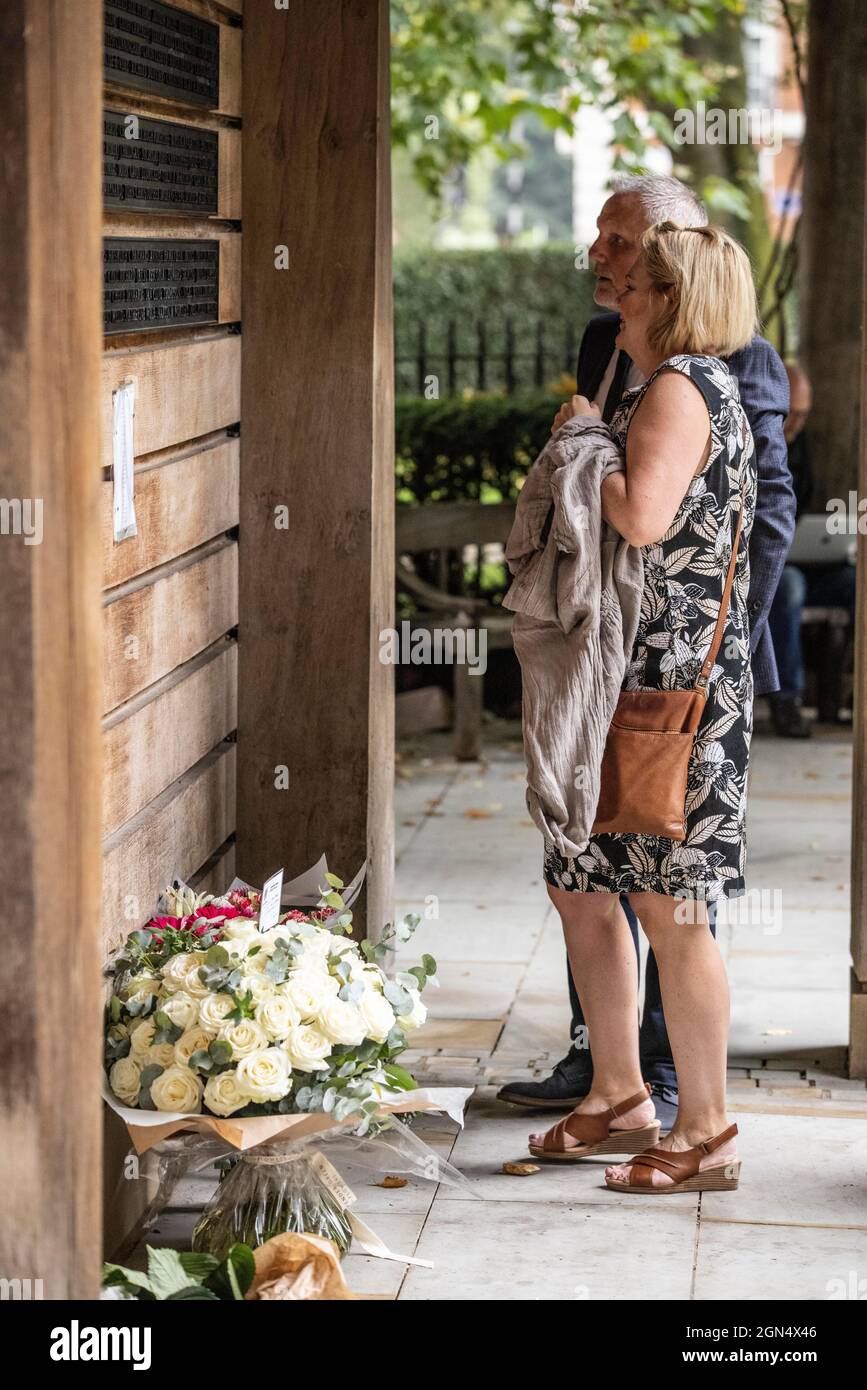 Families pay their respects at the September 11 Memorial Garden in London's Grosvenor Square on the 20th Anniversary of the 9/11 terrorist attacks. Stock Photo