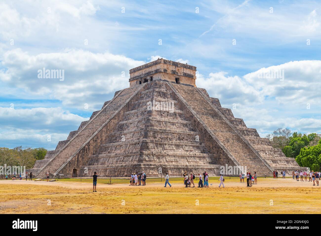 Group of tourists by mayan Kukulkan pyramid in Chichen Itza, Mexico. Stock Photo