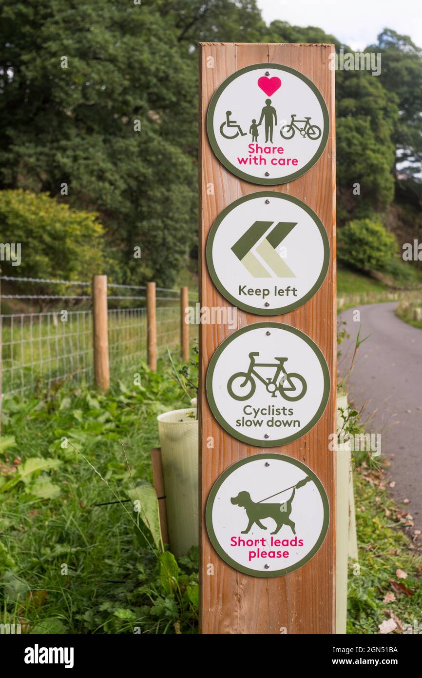 A sign advising users to share the coast to coast C2C cycle path, between Keswick and Threlkeld, with care, Cumbria, England, UK Stock Photo