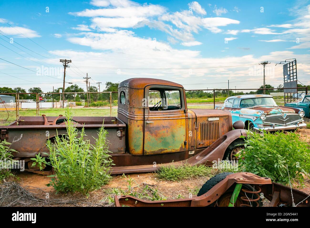 vintage wrecked American cars in junkyard near Amarillo on Route 66 USA
