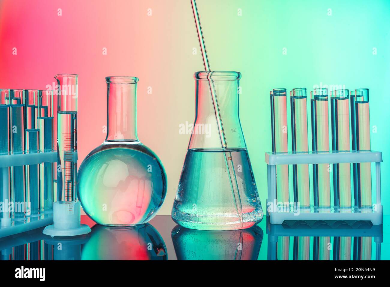 Laboratory chemistry glassware on green toned background Stock Photo - Alamy