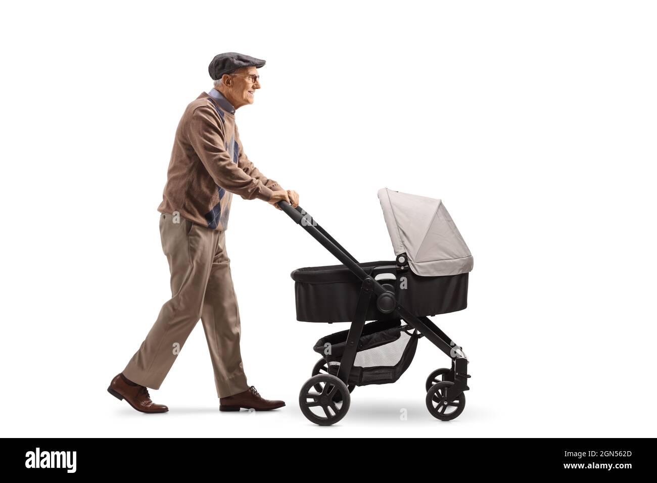 Full length profile shot of a grandfather walking with a pushchair isolated on white background Stock Photo