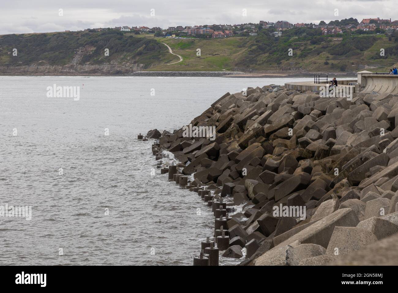 Sea defences mad of concrete Blocks protecting Scarborough harbour and Town. Stock Photo