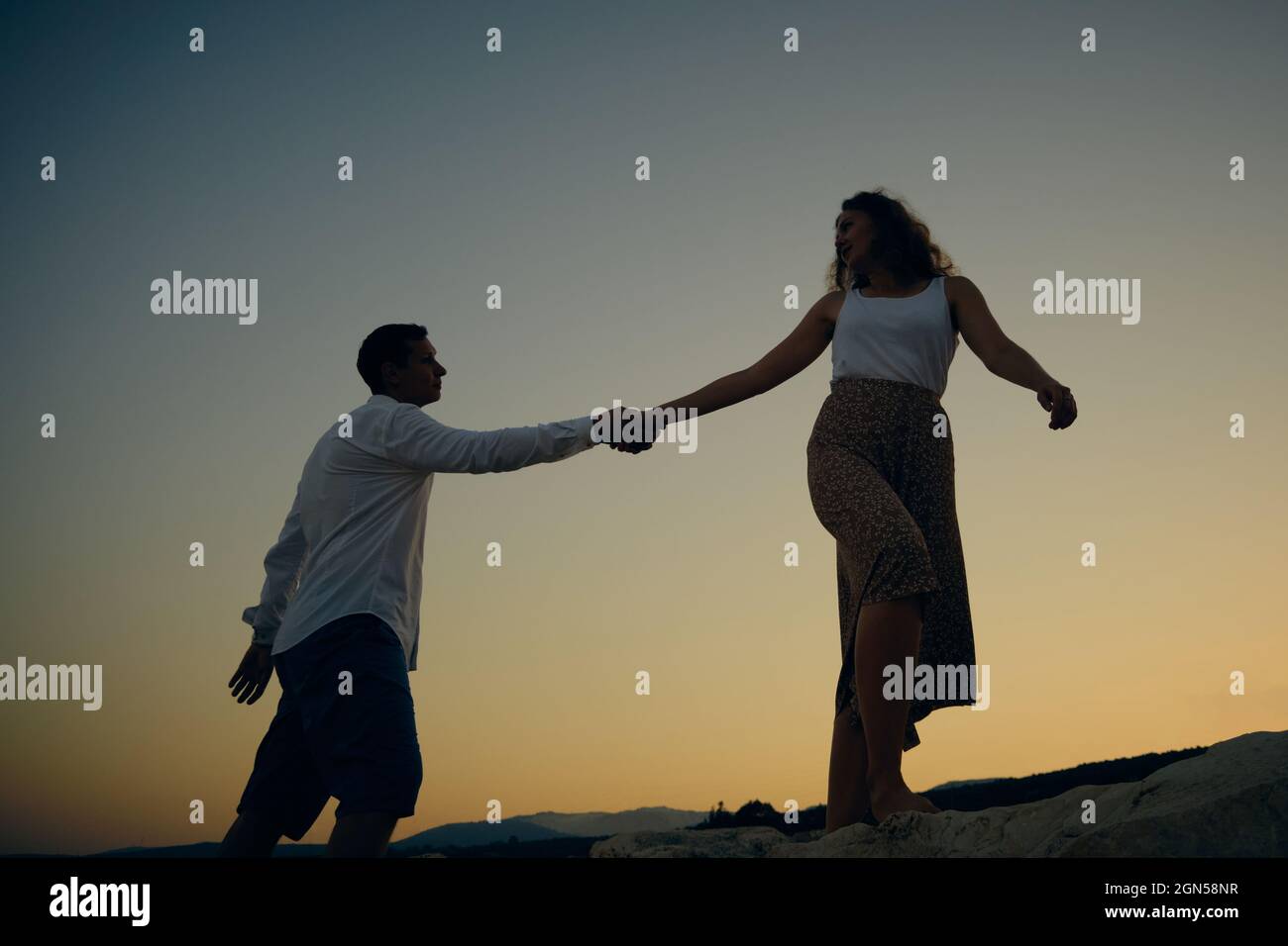 Man and woman holding hands Stock Photo