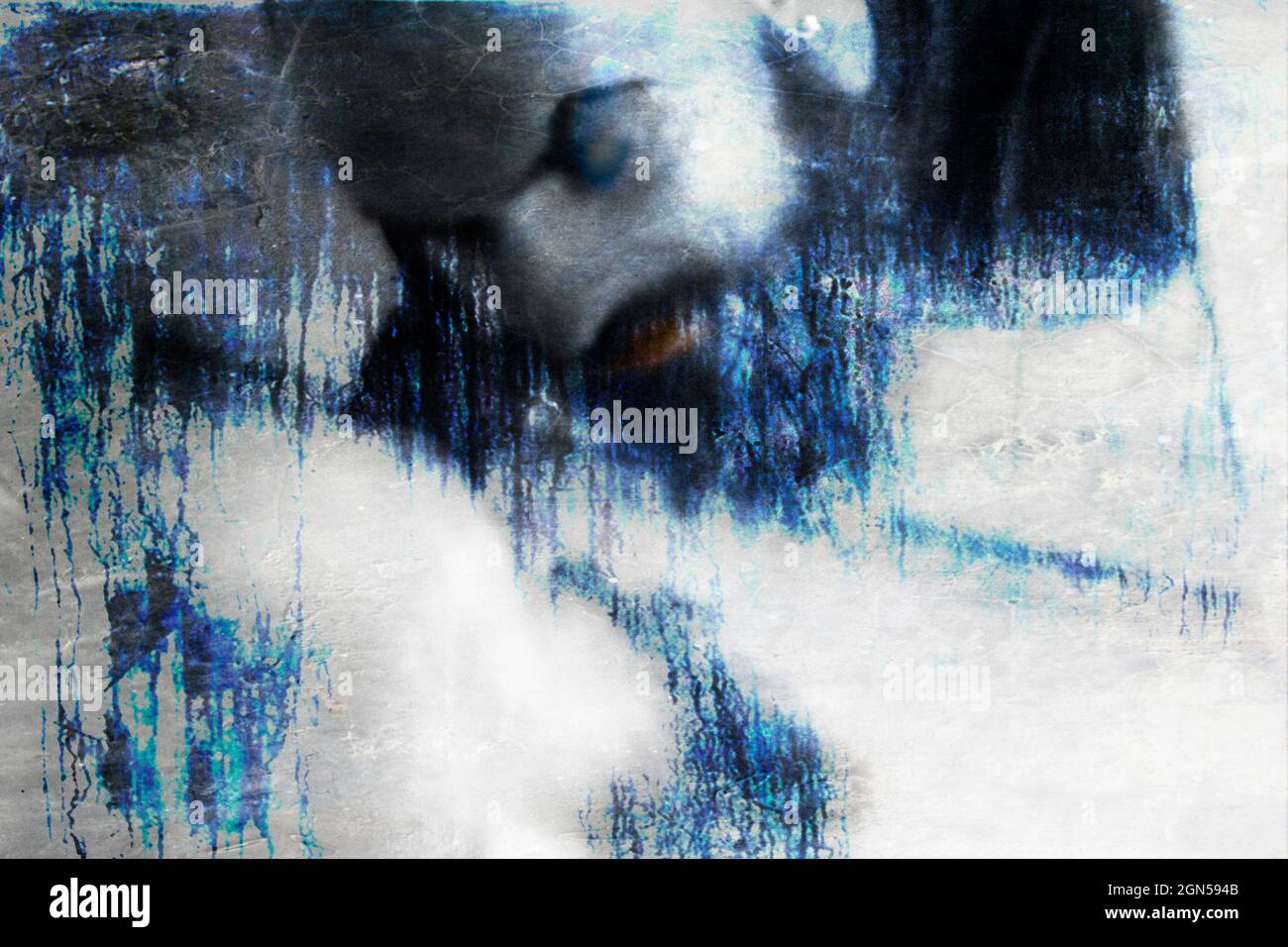 Surreal portrait of a man. The blurred human face blends in with the original background. Mystical scene. Halloween concept. Stock Photo