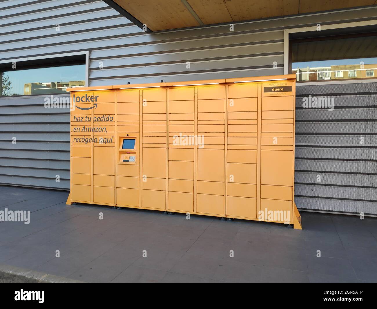 PLASENCIA, SPAIN - Apr 20, 2021: An Amazon locker that Amazon customers can use as a pick up point for mail ordered products at the entrance of a popu Stock Photo