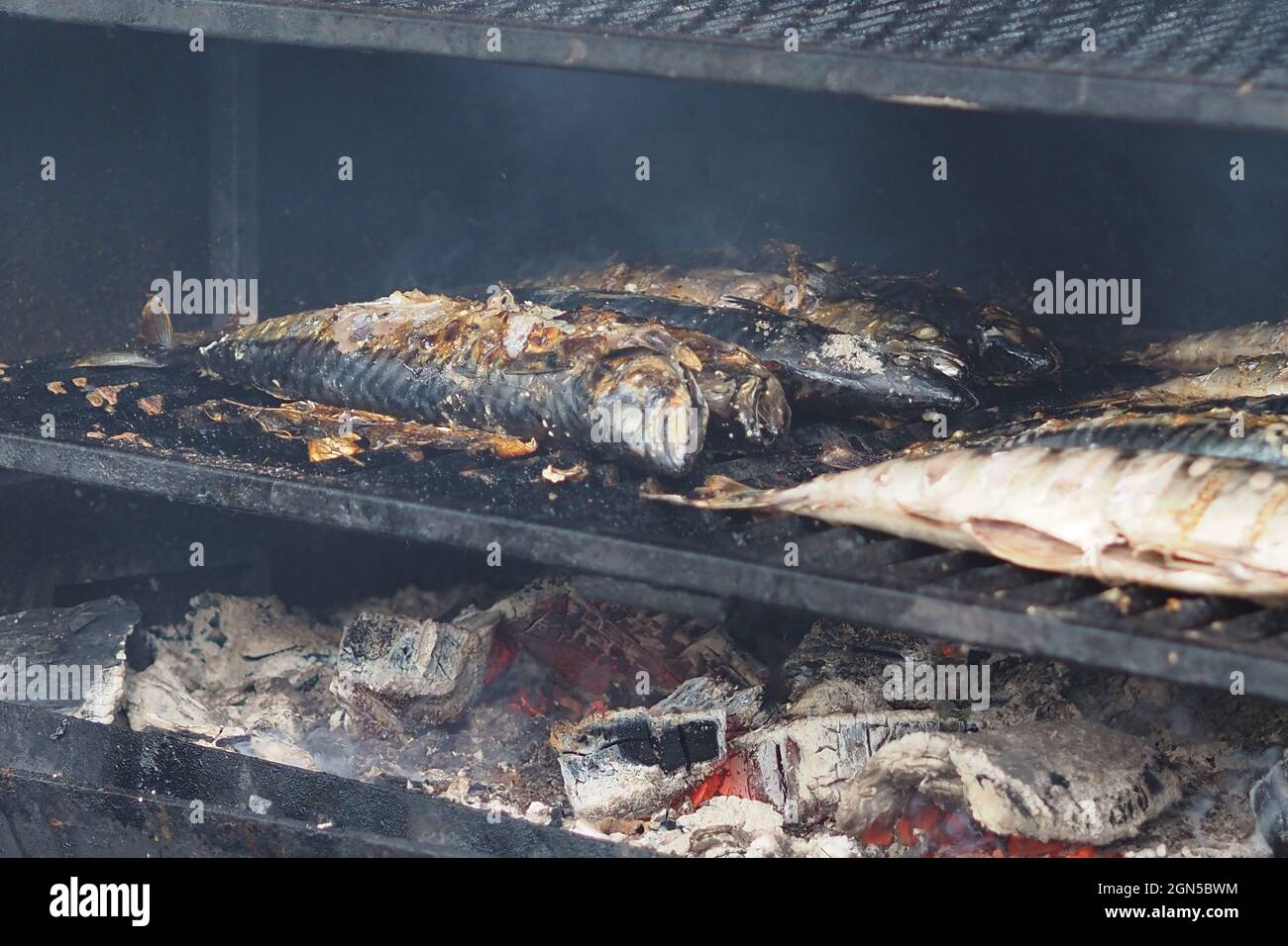 Cooking food on coals in the oven. Baked fish on coals Stock Photo Alamy