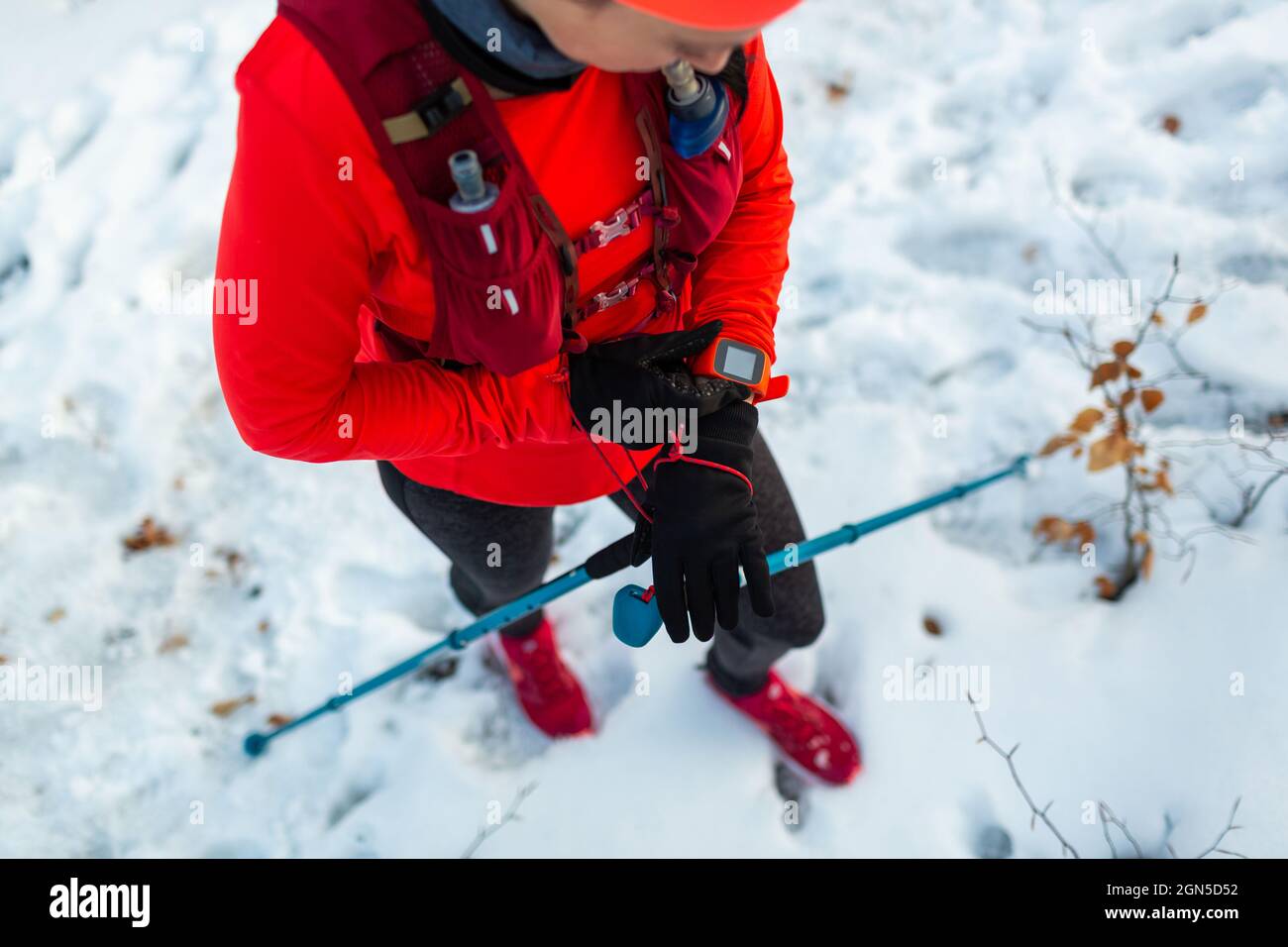 Female Runner Setting Up Fitness Smart Watch for Trail Running. Top View of Sportswoman With