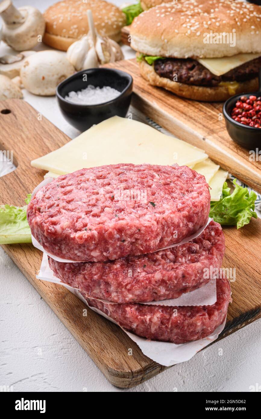 Raw ground beef meat cutlets for burger on white background Stock Photo Alamy