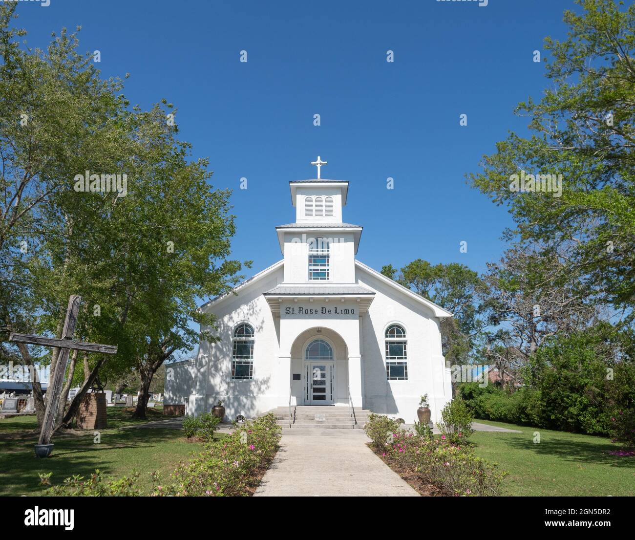 White stucco exterior of the St. Rose de Lima Roman Catholic Church in Bay St. Louis, Mississippi. Stock Photo