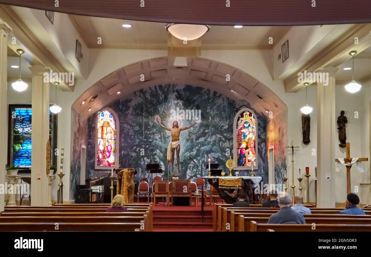 4/1/2021 Bay St. Louis, Mississippi, Interior of the St. Rose de Lima Catholic church with the mural, Christ in the Oaks painted by Armenian artist, A Stock Photo
