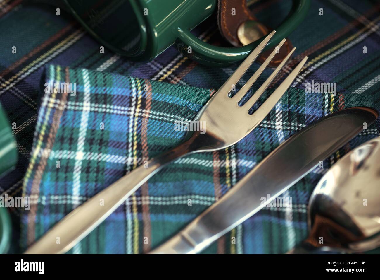 Green plastic kitchenware on a table close up Stock Photo