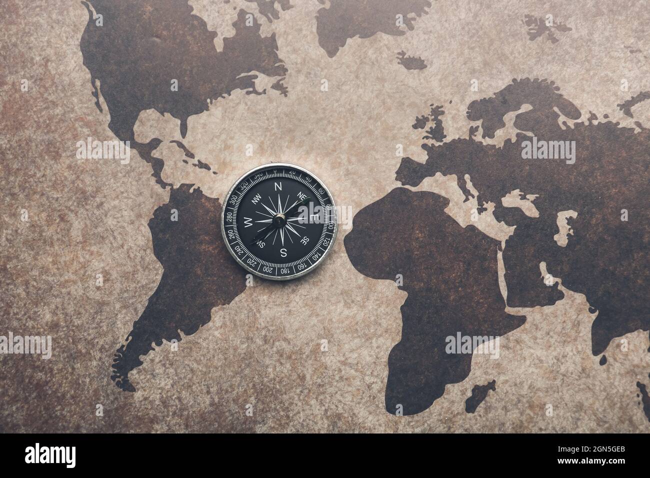 Old compass on vintage world map Stock Photo - Alamy